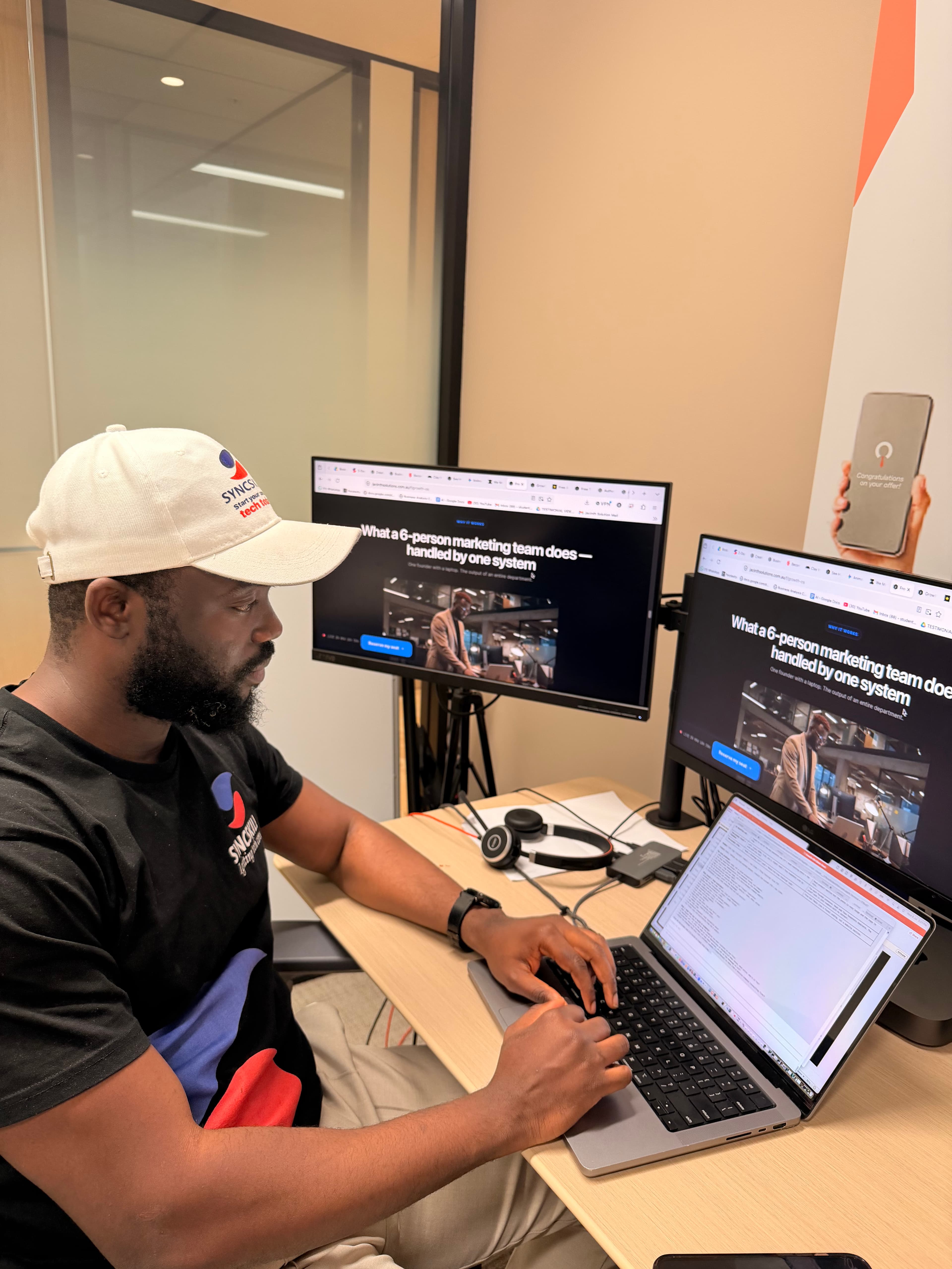 Noah Oloja at his desk