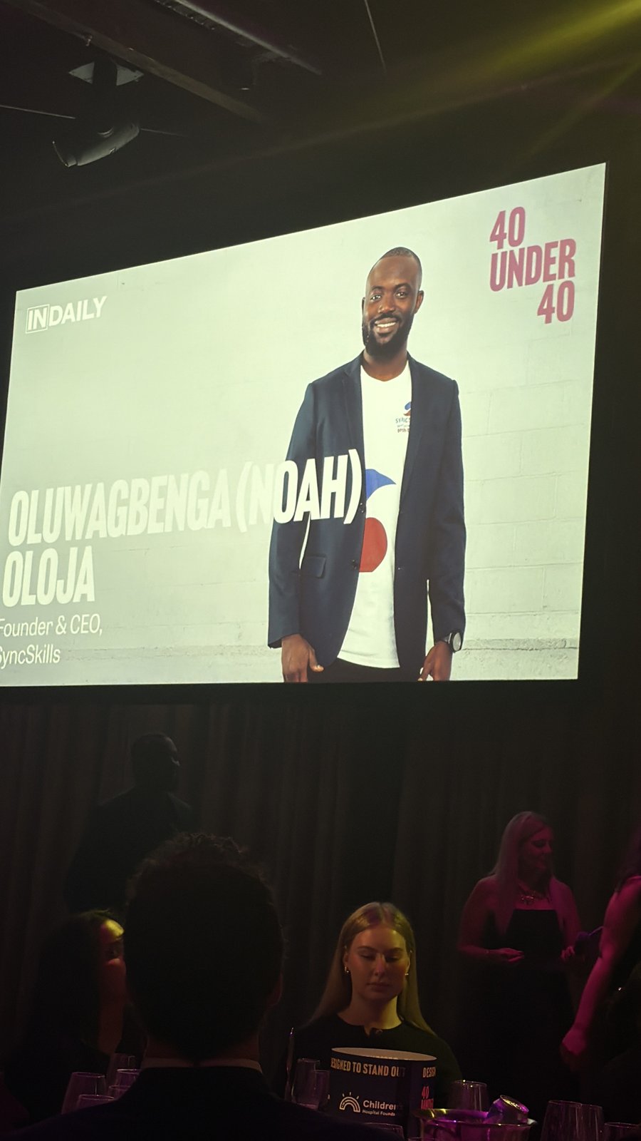 Noah Oloja on the big screen at the InDaily 40 Under 40 awards